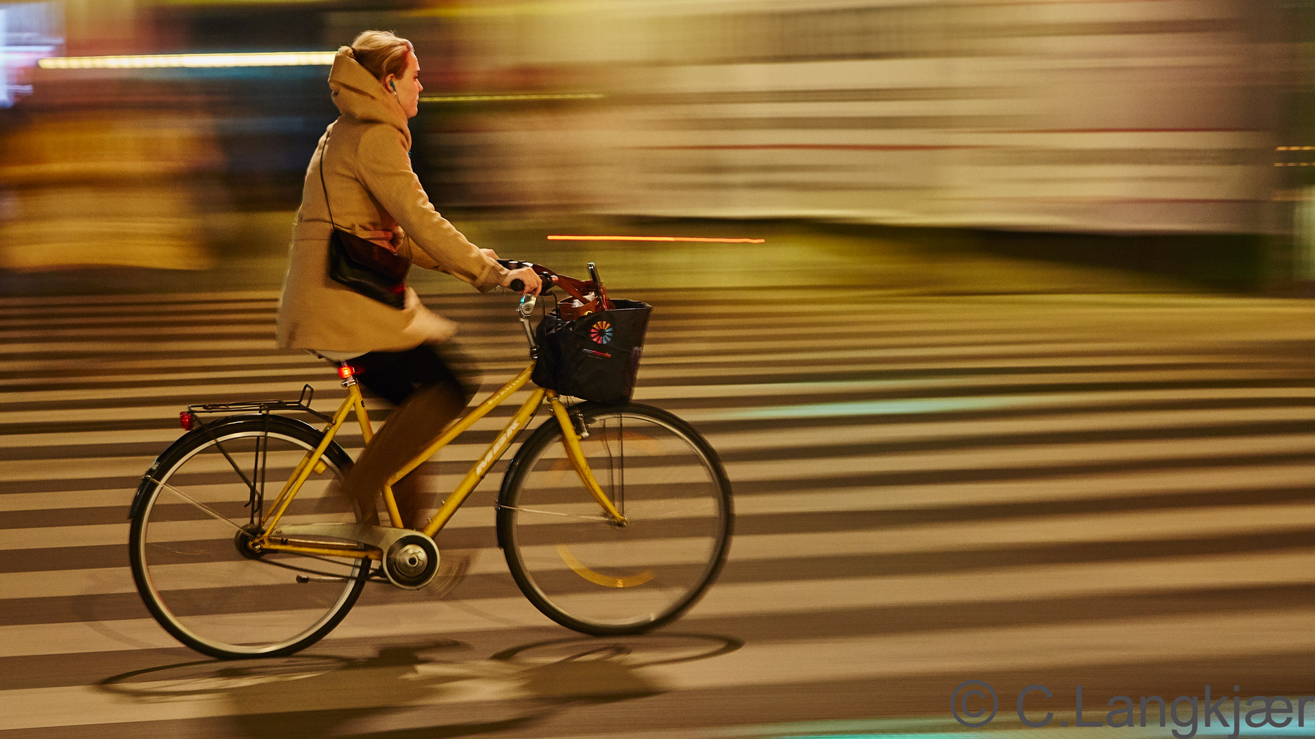 Yellow bike under young woman